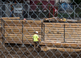 A construction worker can be seen on the South Crouse Avenue site where Hungry Chuck's and Funk 'n Waffles used to be. Photo taken July 25, 2017